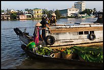 People buying fruit on boats, Cai Rang floating market. Can Tho, Vietnam (color)