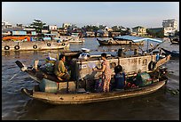 Seller and buyer talking across boats, Cai Rang floating market. Can Tho, Vietnam (color)