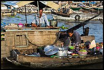 Woman serving food across boats, Cai Rang floating market. Can Tho, Vietnam ( color)