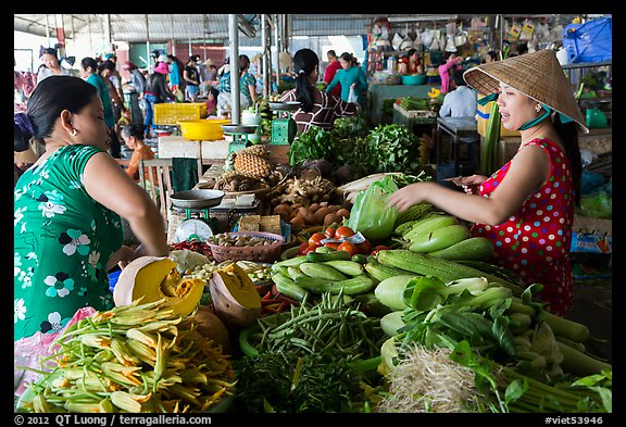Buying and selling vegetable inside covered market, Cai Rang. Can Tho, Vietnam (color)