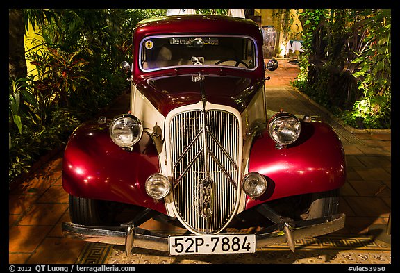Old Citroen car in garden. Ho Chi Minh City, Vietnam (color)