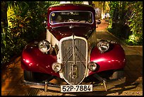 Old Citroen car in garden. Ho Chi Minh City, Vietnam (color)