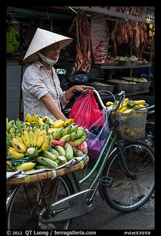 Woman selling bananas from bicycle. Ho Chi Minh City, Vietnam (color)