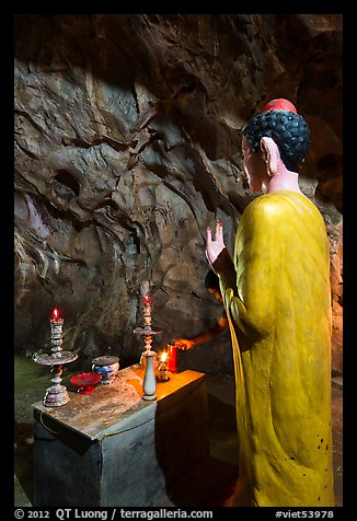 Buddha statue in narrow cave, Marble Mountains. Da Nang, Vietnam