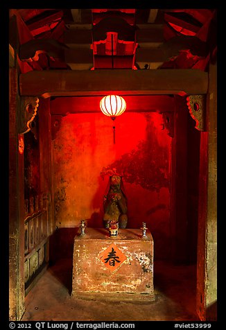 Monkey altar lit by lantern, Japanese Bridge. Hoi An, Vietnam (color)