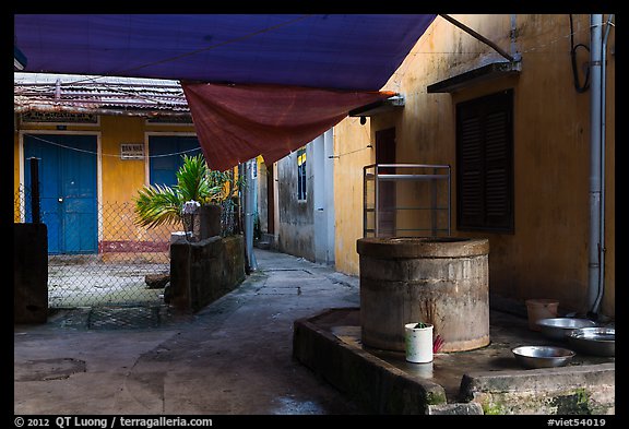 Well and alley. Hoi An, Vietnam (color)