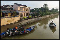 Waterfront with people selling from boats. Hoi An, Vietnam (color)