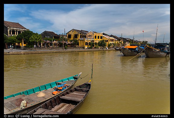 Boats, Thu Bon River, and houses. Hoi An, Vietnam (color)