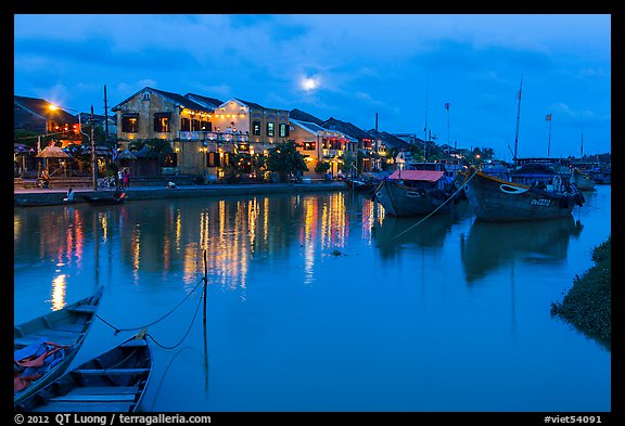 Waterfront, boats, and Thu Bon River at dusk. Hoi An, Vietnam (color)