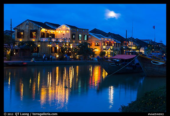 Moonrise over houses and river. Hoi An, Vietnam (color)