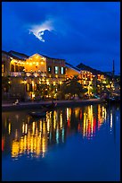 Ancient townhouses and moon reflected in river. Hoi An, Vietnam (color)