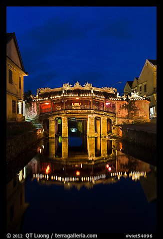 Illuminated Japanese covered bridge reflected in canal. Hoi An, Vietnam (color)