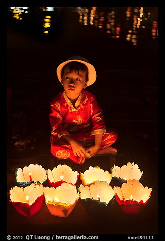 Boy with candle lanterns for sale. Hoi An, Vietnam (color)