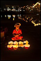 Boy selling candle lanterns by the river. Hoi An, Vietnam ( color)