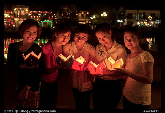 Group of women holding candles. Hoi An, Vietnam (color)