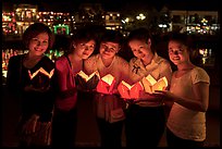 Group of women holding candles. Hoi An, Vietnam (color)