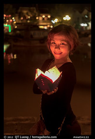Young woman with candle box. Hoi An, Vietnam (color)