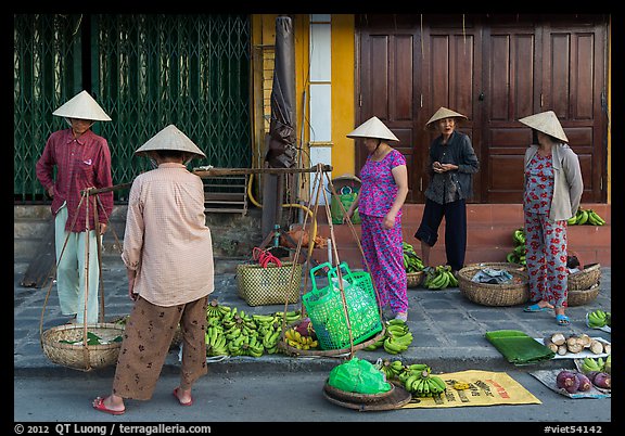 Curbside fruit vendors. Hoi An, Vietnam (color)