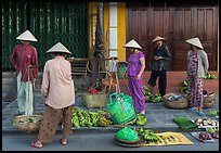 Curbside fruit vendors. Hoi An, Vietnam (color)