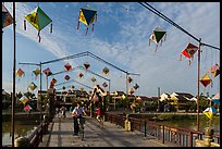 Schoolchildren cross Cam Nam bridge. Hoi An, Vietnam (color)