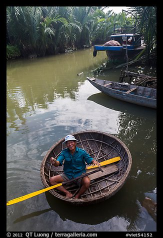 Man in circular boat near Cam Kim Village. Hoi An, Vietnam (color)