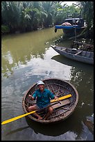 Man in circular boat near Cam Kim Village. Hoi An, Vietnam ( color)