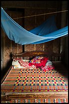 Wooden bed with straw mat and mosquito net, Cam Kim Village. Hoi An, Vietnam ( color)