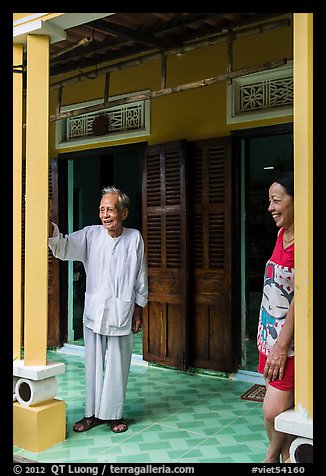 Woman and elder on porch of their house, Cam Kim Village. Hoi An, Vietnam (color)