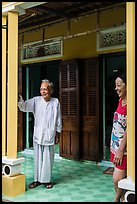Woman and elder on porch of their house, Cam Kim Village. Hoi An, Vietnam (color)