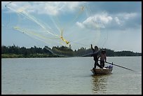Fisherman throwing net, Thu Bon River. Hoi An, Vietnam ( color)