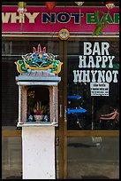 Curbside altar in front of bar. Hoi An, Vietnam ( color)