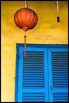 Paper lantern, wall, and blue shutters. Hoi An, Vietnam (color)