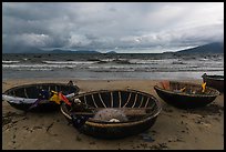 Coracle boats on beach during storm. Da Nang, Vietnam ( color)