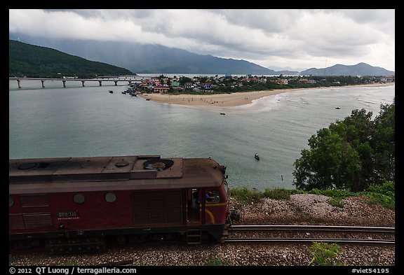 Train, bay, and village. Vietnam (color)