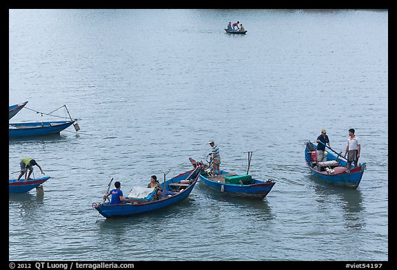 Fishermen on small boats. Vietnam (color)