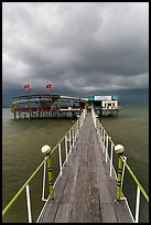 Boarwal, offshore restaurant, and threatening clouds. Vietnam (color)