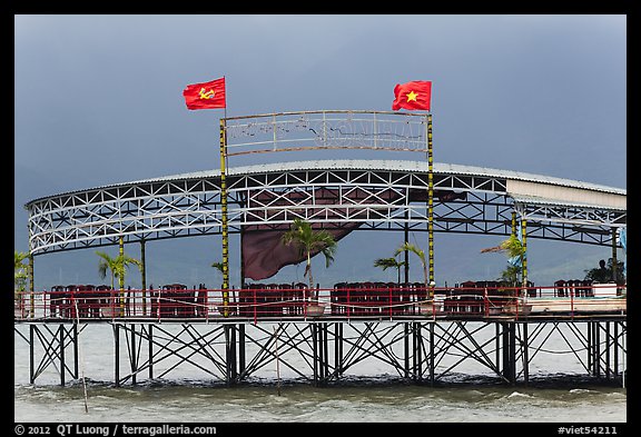 Communist flags flying on restaurant. Vietnam (color)