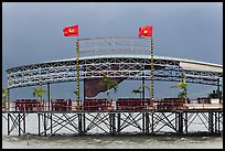 Communist flags flying on restaurant. Vietnam (color)