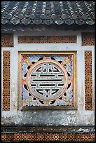 Window in the motif of Chinese symbol meaning Longevity, citadel. Hue, Vietnam (color)