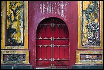 Red door and ceramic decorations, imperial citadel. Hue, Vietnam (color)