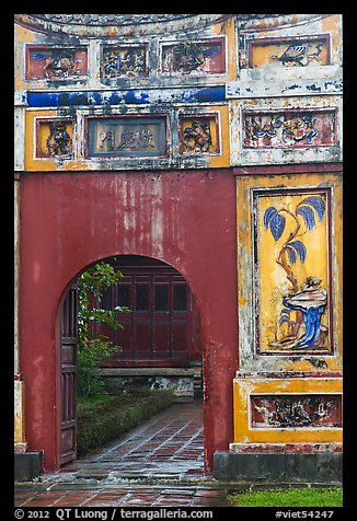 Palace gate with ceramic decorations, citadel. Hue, Vietnam (color)