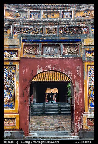 Palace and silhouettes seen from doorway, citadel. Hue, Vietnam (color)