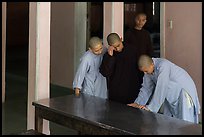 Monks looking at book, Thien Mu pagoda. Hue, Vietnam ( color)