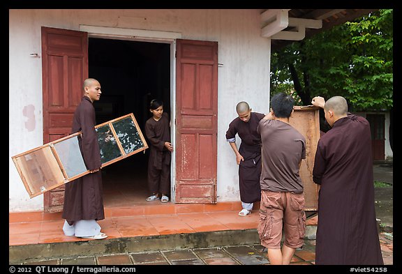 Monks carrying furniture, Thien Mu pagoda. Hue, Vietnam (color)