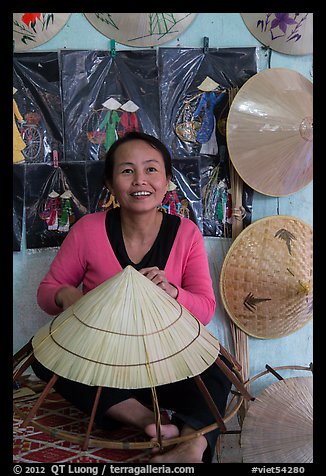 Woman making the Vietnamese conical hat. Hue, Vietnam