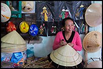 Woman in hat-making workshop. Hue, Vietnam ( color)