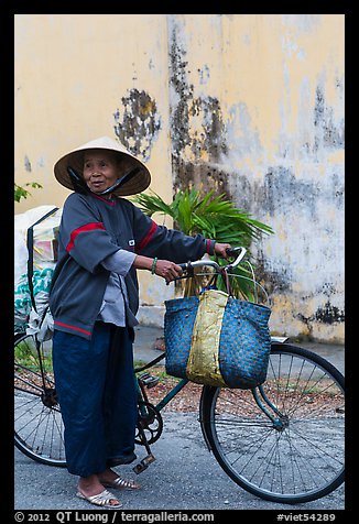 Elderly woman with bicycle, Thanh Toan. Hue, Vietnam (color)