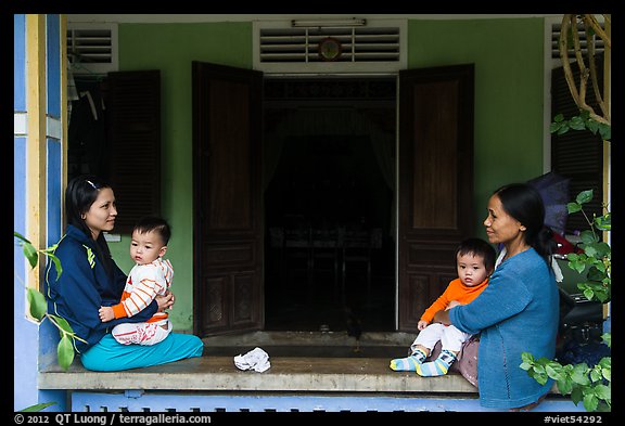 Mothers and infants on porch, Thanh Toan. Hue, Vietnam (color)