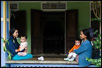 Mothers and infants on porch, Thanh Toan. Hue, Vietnam (color)