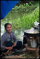 Woman cooking canalside, Thanh Toan. Hue, Vietnam (color)